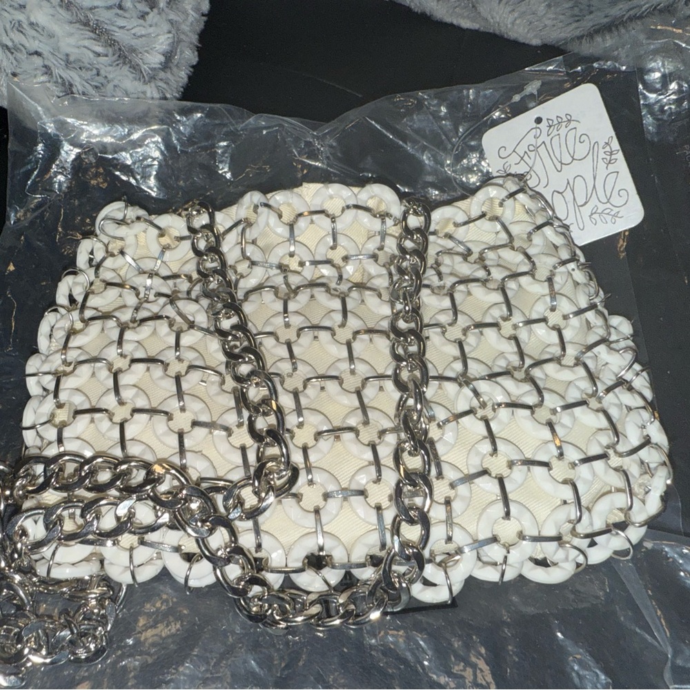 Small white and silver bag, very detailed NV used with tags,